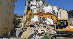 Men working at collapsed house