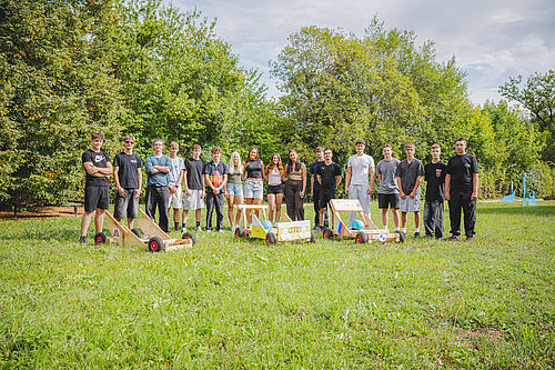 Group photo of apprentices with soapbox cars